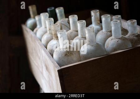 old empty bottles, essences for alcoholic beverages, old Ripoll winery, Llucmajor, . Majorca, Balearic Islands, Spain. Stock Photo