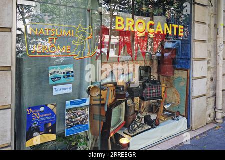 Window display of a Parisian vintage furniture shop, Brocante, Natsumi et Jerome on de la Tour-Maubourg Stock Photo