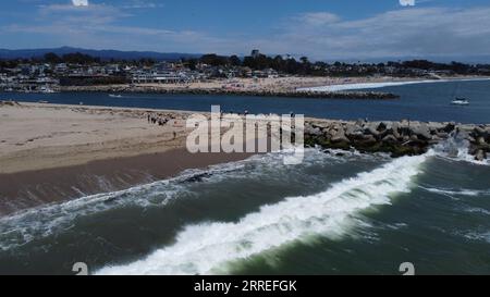 White Waves With Beach and Rocks Stock Photo