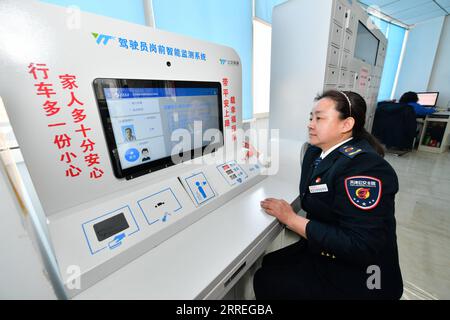 220228 -- TIANJIN, Feb. 28, 2022 -- Wang Yan checks her blood pressure before starting her shift at a bus service office in north China s Tianjin, Feb. 24, 2022. Tianjin bus driver Wang Yan is a National People s Congress NPC deputy. Since taking on her duties in 2018, Wang has continued to submit suggestions to the NPC, covering a variety of areas, such as transportation and health care. As a bus driver, she makes the most of her job, listening to her passengers opinions, while formulating suggestions that can have an influence on government policies. This year is the last year of her term of Stock Photo