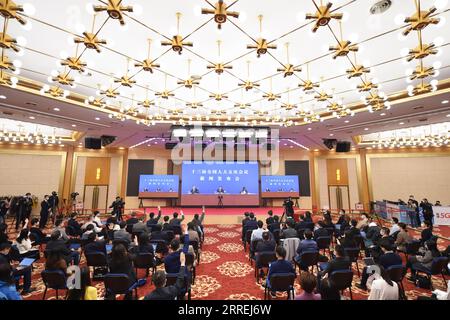 220304 -- BEIJING, March 4, 2022 -- Journalists attend a press conference of the fifth session of the 13th National People s Congress NPC via video link in Beijing, capital of China, March 4, 2022. The press conference was held via video link due to COVID-19 prevention and control requirements.  TWO SESSIONSCHINA-BEIJING-NPC-PRESS CONFERENCE CN ChenxZhonghao PUBLICATIONxNOTxINxCHN Stock Photo