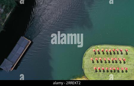 220307 -- ZHANGJIAJIE, March 7, 2022 -- Aerial photo taken on March 7, 2022 shows a ship sailing across Baofeng Lake of Wulingyuan District in Zhangjiajie, central China s Hunan Province. Photo by /Xinhua CHINA-SPRING-SCENERY CN WuxYongbing PUBLICATIONxNOTxINxCHN Stock Photo