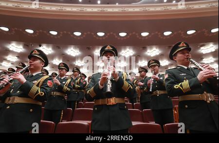 220310 -- BEIJING, March 10, 2022 -- The military band of the Chinese People s Liberation Army performs during the closing meeting of the fifth session of the 13th National Committee of the Chinese People s Political Consultative Conference CPPCC at the Great Hall of the People in Beijing, capital of China, March 10, 2022.  TWO SESSIONS CHINA-BEIJING-CPPCC-ANNUAL SESSION-CLOSING MEETING CN LuxYe PUBLICATIONxNOTxINxCHN Stock Photo