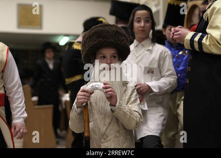 220316 -- ASHDOD ISRAEL, March 16, 2022 -- An ultra-Orthodox child wearing costume for Purim attends a reading of the Megillat Esther during the Jewish holiday of Purim at a synagogue in Ashdod, southern Israel, on March 16, 2022. Purim is a Jewish holiday that commemorates the deliverance of the Jewish people from Haman s plot during the reign of the ancient Persian Empire, according to the Biblical Book of Esther.  via Xinhua ISRAEL-ASHDOD-PURIM-MEGILLAT ESTHER-READING IlanxAssayag/JINI PUBLICATIONxNOTxINxCHN Stock Photo