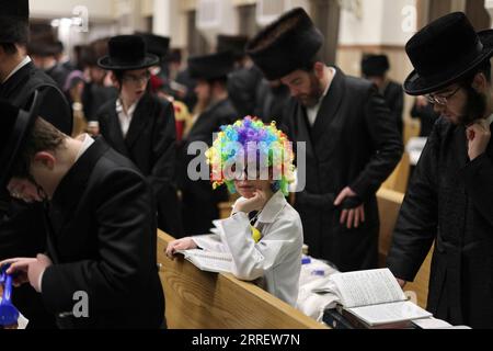 220316 -- ASHDOD ISRAEL, March 16, 2022 -- An ultra-Orthodox child wearing costume for Purim attends a reading of the Megillat Esther during the Jewish holiday of Purim at a synagogue in Ashdod, southern Israel, on March 16, 2022. Purim is a Jewish holiday that commemorates the deliverance of the Jewish people from Haman s plot during the reign of the ancient Persian Empire, according to the Biblical Book of Esther.  via Xinhua ISRAEL-ASHDOD-PURIM-MEGILLAT ESTHER-READING IlanxAssayag/JINI PUBLICATIONxNOTxINxCHN Stock Photo