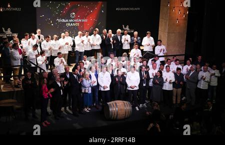 220323 -- COGNAC, March 23, 2022 -- Chefs celebrate after being awarded during the 2022 edition of the Michelin Guide award ceremony in Cognac, France, March 22, 2022. The Michelin Guide launched its 2022 edition on Tuesday in Cognac, the first time in its 122 years the ceremony has taken place outside Paris. Two restaurants were awarded the highest distinction of three stars.  FRANCE-COGNAC-MICHELIN GUIDE-AWARD CEREMONY GaoxJing PUBLICATIONxNOTxINxCHN Stock Photo