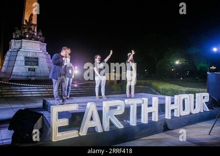 220326 -- MANILA, March 26, 2022 -- Environmental advocates hold a program at Rizal Park during the annual Earth Hour in Manila, the Philippines on March 26, 2022.  PHILIPPINES-MANILA-EARTH HOUR RouellexUmali PUBLICATIONxNOTxINxCHN Stock Photo