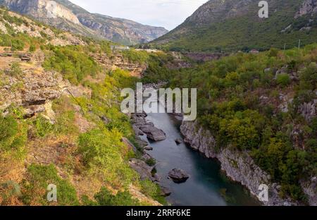 Beautiful view of the deepest Tara River Canyon surrounded by green forest and cliffs with. The most dangerous Moraca Canyon Road in Montenegro Stock Photo