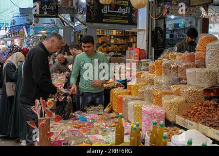 220402 -- GAZA CITY, April 2, 2022 -- A man shops at Al-Zawiya market ahead of Ramadan in Gaza City, on March 31, 2022. TO GO WITH Feature: Palestinians prepare for Ramadan amid increasing prices of goods Photo by /Xinhua MIDEAST-GAZA CITY-RAMADAN-SHOPPING RizekxAbdeljawad PUBLICATIONxNOTxINxCHN Stock Photo