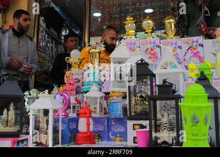 220402 -- GAZA CITY, April 2, 2022 -- A vendor sells lanterns at Al-Zawiya market ahead of Ramadan in Gaza City, on March 31, 2022. TO GO WITH Feature: Palestinians prepare for Ramadan amid increasing prices of goods Photo by /Xinhua MIDEAST-GAZA CITY-RAMADAN-SHOPPING RizekxAbdeljawad PUBLICATIONxNOTxINxCHN Stock Photo