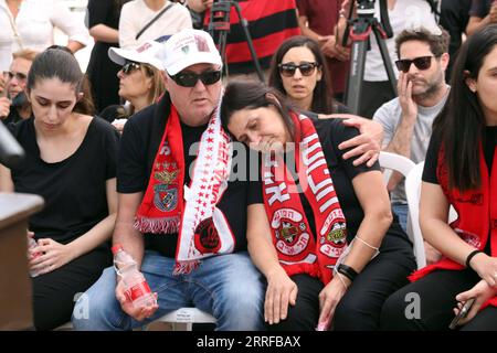 220410 -- KFAR SABA ISRAEL, April 10, 2022 -- Parents of a victim mourn during a funeral in Kfar Saba, Israel, on April 10, 2022. Three Israeli people were killed in a shooting attack by a Palestinian man in central Tel Aviv on the evening of April 7. The Palestinian gunman was killed by Israeli forces in the early morning of the next day after several hours of a manhunt. Gideon via Xinhua ISRAEL-KFAR SABA-SHOOTING ATTACK-VICTIM-FUNERAL Markowicz/JINI PUBLICATIONxNOTxINxCHN Stock Photo