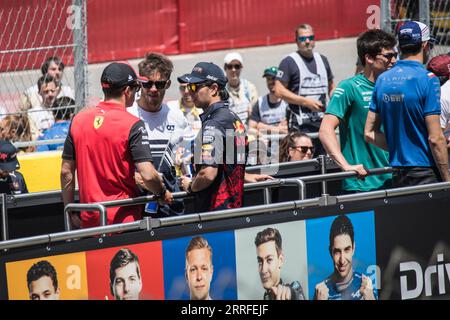 Charles Leclerc, Pierre Gasly, Sergio Perez, and Lance Stroll participate in the Drivers' Parade. Stock Photo