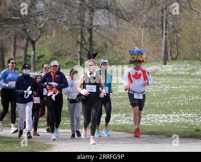 220416 -- VANCOUVER, April 16, 2022 -- People take part in the Big Easter Run in Vancouver, British Columbia, Canada, on April 16, 2022. Photo by /Xinhua CANADA-VANCOUVER-BIG EASTER RUN LiangxSen PUBLICATIONxNOTxINxCHN Stock Photo