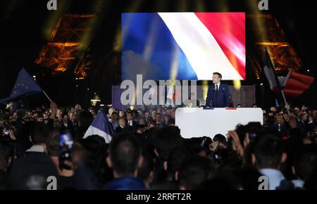 220425 -- PARIS, April 25, 2022 -- French incumbent President Emmanuel Macron addresses a rally after the presidential runoff in Paris, France, on April 24, 2022.  Xinhua Headlines: Macron re-elected as French president amid domestic, international uncertainty GaoxJing PUBLICATIONxNOTxINxCHN Stock Photo