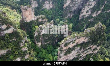 220427 -- ZHANGJIAJIE, April 27, 2022 -- Aerial photo taken on April 20, 2022 shows a view of the Wulingyuan scenic area in Zhangjiajie, central China s Hunan Province. Wulingyuan, a UNESCO World Heritage Site, is noted for its unique quartzite sandstone pillars and peaks across most of the site.  SkyEyeCHINA-HUNAN-WULINGYUAN-WORLD HERITAGE SITE-AERIAL VIEW CN ChenxZeguo PUBLICATIONxNOTxINxCHN Stock Photo