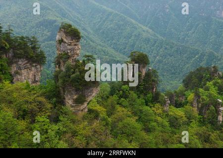 220427 -- ZHANGJIAJIE, April 27, 2022 -- Aerial photo taken on April 20, 2022 shows a view of the Wulingyuan scenic area in Zhangjiajie, central China s Hunan Province. Wulingyuan, a UNESCO World Heritage Site, is noted for its unique quartzite sandstone pillars and peaks across most of the site.  SkyEyeCHINA-HUNAN-WULINGYUAN-WORLD HERITAGE SITE-AERIAL VIEW CN ChenxSihan PUBLICATIONxNOTxINxCHN Stock Photo