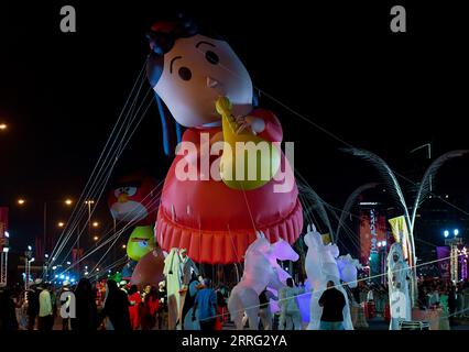 220504 -- DOHA, May 4, 2022 -- People take part in a giant balloon parade during the celebration of the Eid al-Fitr festival in Doha, Qatar, on May 4, 2022. Photo by /Xinhua QATAR-DOHA-EID AL-FITR-CELEBRATIONS Nikku PUBLICATIONxNOTxINxCHN Stock Photo