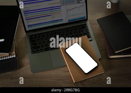 Top-view desk smartphone with blank screen and modern frameless design with copy space Stock Photo