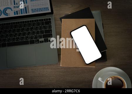 Top-view desk smartphone with blank screen and modern frameless design with copy space Stock Photo