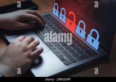 Woman on laptop solving hacker attack. Surveillance and security concept. Internet network security. User privacy security and encryption. Stock Photo