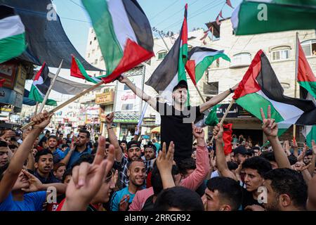 220529 -- GAZA, May 29, 2022 -- Palestinian people protest against the flag march in Jabalia, northern Gaza Strip, on May 29, 2022. Tens of thousands of Palestinians have joined public protests organized in the West Bank and the Gaza Strip against the flag march on Sunday. The controversial flag march through Jerusalem s Old City took place on Sunday to mark Jerusalem Day, which commemorates the unification of the city after Israel annexed East Jerusalem in 1967. Photo by /Xinhua MIDEAST-GAZA-PROTEST RizekxAbdeljawad PUBLICATIONxNOTxINxCHN Stock Photo