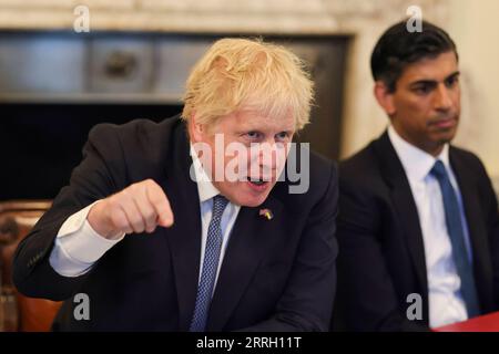 220607 -- LONDON, June 7, 2022 -- British Prime Minister Boris Johnson holds a cabinet meeting in London, Britain, May 17, 2022. Boris Johnson on Monday won a no-confidence vote among Conservative lawmakers, saving his precarious premiership. Johnson won the support of 211 out of 359 lawmakers, dozens more than the threshold of 180 votes, according to the result announced by Graham Brady, chairman of the Conservative Party s parliamentary group, the 1922 Committee. Simon Dawson//Handout via Xinhua BRITAIN-LONDON-BORIS JOHNSON-NO-CONFIDENCE VOTE-WIN No.x10xDowningxStreet PUBLICATIONxNOTxINxCHN Stock Photo