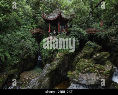 220609 -- CHENGDU, June 9, 2022 -- Photo taken on June 5, 2022 shows the scenery of Mount Emei in southwest China s Sichuan Province. Mount Emei, located in southwest China s Sichuan Province, is an area of striking scenic beauty, notable for its lofty mountain and lush vegetation. It is also of great spiritual and cultural significance, in which there are archaeological sites, important architecture, tombs, ritual spaces, and collections of cultural artefacts, including sculpture, stone inscriptions, calligraphy, and paintings, among other traditional arts. Mount Emei is known as one of the f Stock Photo