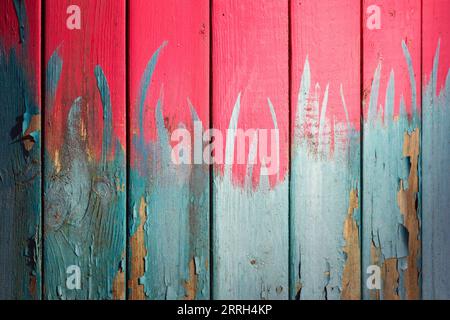 Grungy wooden wall with colorful paint splashes, abstract background photo texture Stock Photo