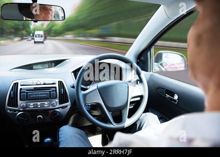 Close-up Of A Man Sitting In Self Driving Car Stock Photo