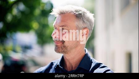 Confident Man Portrait. Male Person Standing Outdoors Stock Photo
