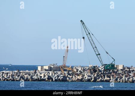 220620 -- ALEXANDRIA, June 20, 2022 -- Concrete barriers used against sea-level rises are seen along the coastline in Alexandria, Egypt, June 19, 2022. The Egyptian Ministry of Water Resources and Irrigation has launched a climate adaptation project on the North Coast and the Nile Delta to counter sea-level rises, the impact of weather hazards on low-lying coastal areas, and seawater intrusion.  EGYPT-ALEXANDRIA-CLIMATE CHANGE-RISING SEA LEVEL-COASTAL CONCRETE BARRIER AhmedxGomaa PUBLICATIONxNOTxINxCHN Stock Photo