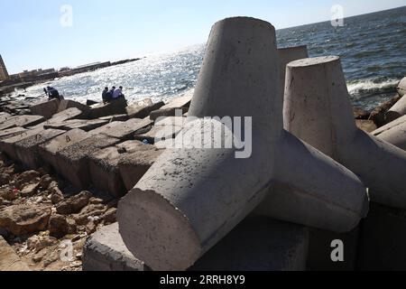 220620 -- ALEXANDRIA, June 20, 2022 -- Concrete barriers used against sea-level rises are seen along the coastline in Alexandria, Egypt, June 19, 2022. The Egyptian Ministry of Water Resources and Irrigation has launched a climate adaptation project on the North Coast and the Nile Delta to counter sea-level rises, the impact of weather hazards on low-lying coastal areas, and seawater intrusion.  EGYPT-ALEXANDRIA-CLIMATE CHANGE-RISING SEA LEVEL-COASTAL CONCRETE BARRIER AhmedxGomaa PUBLICATIONxNOTxINxCHN Stock Photo