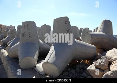 220620 -- ALEXANDRIA, June 20, 2022 -- Concrete barriers used against sea-level rises are seen along the coastline in Alexandria, Egypt, June 19, 2022. The Egyptian Ministry of Water Resources and Irrigation has launched a climate adaptation project on the North Coast and the Nile Delta to counter sea-level rises, the impact of weather hazards on low-lying coastal areas, and seawater intrusion.  EGYPT-ALEXANDRIA-CLIMATE CHANGE-RISING SEA LEVEL-COASTAL CONCRETE BARRIER AhmedxGomaa PUBLICATIONxNOTxINxCHN Stock Photo