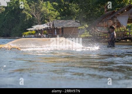 220621 -- VIENTIANE, June 21, 2022 -- A man fishes in the Nam Lik River, in Muang Fueng, a rising tourist town some 100 km north of Lao capital Vientiane, June 17, 2022. Photo by /Xinhua LAOS-VIENTIANE-MUANG FUENG-TOURISM-DAILY LIFE KaikeoxSaiyasane PUBLICATIONxNOTxINxCHN Stock Photo