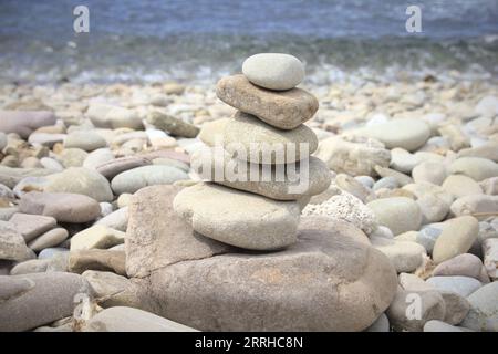 A pile of stones in a beach Stock Photo