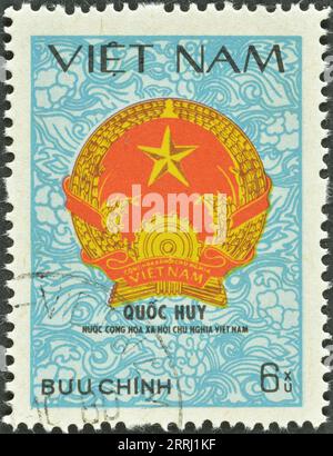 Cancelled postage stamp printed by Vietnam, that shows Vietnamese Arms, circa 1980. Stock Photo