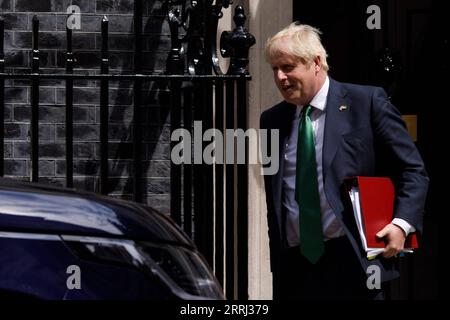 220713 -- LONDON, July 13, 2022 -- British Prime Minister Boris Johnson leaves 10 Downing Street for Prime Minister s Questions in London, Britain, July 13, 2022. Boris Johnson resigned as British prime minister and the leader of the Conservative Party in a statement to the country on July 7. The new prime minister of the United Kingdom UK replacing incumbent Boris Johnson will be announced on September 5, said Graham Brady, chairman of the Conservative Party s backbench 1922 Committee, on Monday. Photo by /Xinhua BRITAIN-LONDON-BORIS JOHNSON-PMQ TimxIreland PUBLICATIONxNOTxINxCHN Stock Photo