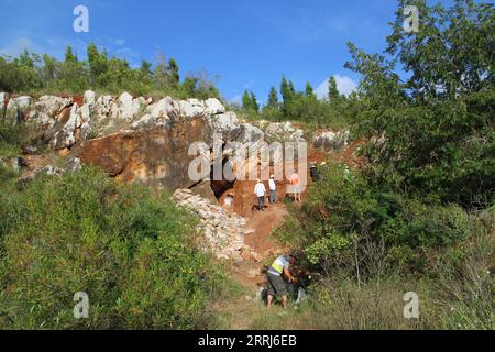 220715 -- KUNMING, July 15, 2022  -- Undated photo provided by Yunnan Institute of Cultural Relics and Archaeology shows a cave where the remains of the Mengzi Ren MZR are unearthed, in Mengzi, southwest China s Yunnan Province. Scientists have unveiled a Late Pleistocene human genome from southwest China. Their findings were published online in the journal Current Biology on Thursday night. The scientists conducted the genome sequencing of the 14,000-year-old human remains of the Mengzi Ren MZR, which were unearthed in 1989 in a cave in Mengzi, Yunnan Province. More than 30 human fossils, as Stock Photo