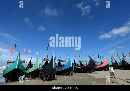 220716 -- COX S BAZAR, July 16, 2022 -- Fishing boats are tied along the shore in Cox s Bazar, Bangladesh on July 13, 2022. Like previous years, Bangladesh banned fishing off its coast for 65 days from May 20 in order to help ensure smooth breeding of fish and boost depleted fish stocks. The once bustling fishermen s wharfs in places in Cox s Bazar, some 400 southeast of capital Dhaka, lie dormant, with dozens of fishing boats tied along the shores. BANGLADESH-COX S BAZAR-FISHING BAN Salim PUBLICATIONxNOTxINxCHN Stock Photo
