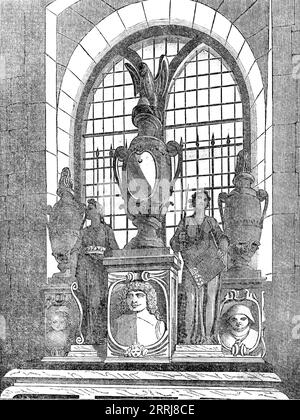 The Stanley Monument in Chelsea Old Church, restored by the Earl of Derby in 1858, (1858). 'At the east end of the chapel [in the old Church of St. Luke] is...an altartomb, made of yellow-veined alabaster...[It] is 7 feet 3 inches long by 12 feet high. In the middle is a scutcheoned urn, surmounted by an eagle, the square base of the urn containing an alto-relievo portrait of Sir Robert Stanley. On either side are two smaller urns, surmounted by gilded flames, the square bases being decorated by portraits of the two children of Sir Robert. Between the centre urn and that on the left is a figur Stock Photo