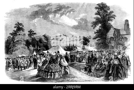 Mowing, Shearing, and Cottagers' Flower Show, at Coleshill Park - the Distribution of the Prizes, 1858. 'For fourteen years the noble owner of Coleshill, the Earl of Radnor - with the view not only of exciting honourable and honest emulation among labourers in the several departments of agricultural skill, but of inducing them to attend carefully to their families and homes, and to devote their leisure hours to the cultivation of their gardens, by which their own domestic comfort might be enhanced - has held an annual gathering of these classes in his park, and awarded to them such prizes as t Stock Photo