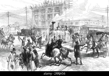Broad-Street, Philadelphia, from a sketch by one of our special artists, 1876. '...view of Broad-street, at the crossing of the Pennsylvania and Reading line of railroad. Three or four men, waving signal flags, are stationed there to prevent accidents; but horses are liable to take fright, and there is some danger to nervous foot- passengers'. From &quot;Illustrated London News&quot;, 1876. Stock Photo
