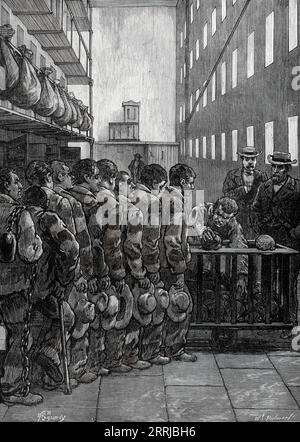 American Prison Life, Blackwell's Island, New York: Dinner-Time, 1876. '...the inmates, who are here treated with compulsory hospitality, must take their mid-day meal upon the conditions prescribed by its ordinary rules. They have to pick up their loaves of bread from a heap protected by the railing shown in Mr. Regamey's sketch, so as to avoid the greedy scramble which might be expected in a company whose manners are likely to be as bad as their morals...There must be a certain degree of strictness in the domestic habits of this large household on Blackwell's Island, which is perhaps not quit Stock Photo