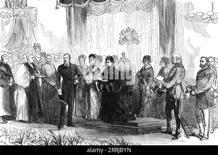 The Royal Visit to the East End: the Queen declaring the new wing of the London Hospital open, 1876. 'The Duke of Cambridge, president of the hospital, the Archbishop of Canterbury, the Bishop of London, and the vice-presidents and treasurer of the hospital, with the Lord Mayor and Sheriffs, and the Secretary of State for the Home Department were in waiting to receive the Queen....The address of the governors was then presented to her Majesty by the Duke of Cambridge, as president, and in this document special stress was laid upon the almost unparalleled response which had been made to the app Stock Photo