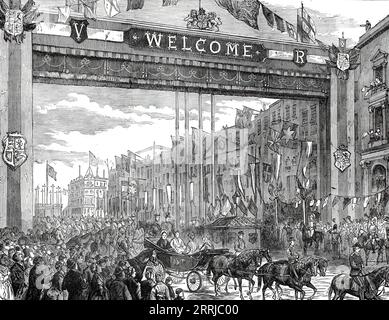 The Queen's Visit to the East End of London: Triumphal Arch in Whitechapel-Road, 1876.  'Her Majesty went...to open the new wing of the London Hospital buildings in Whitechapel-road. It was a high festival for the East End of London...At the City boundary a large triumphal arch, forty feet high, spanning the roadway, had been erected. It was handsomely decorated with flags, and bore on the Aldgate side the inscription, &quot;Welcome to our Queen&quot;...The word &quot;Welcome&quot; occurred repeatedly, sometimes with the addition of &quot;Come again,&quot; and &quot;Thanks for this visit&quot; Stock Photo