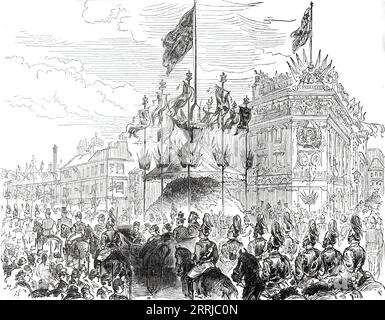 The Queen's Visit to the East End of London: Trophy in Whitechapel-Road, 1876. 'Her Majesty went...to open the new wing of the London Hospital buildings in Whitechapel-road. It was a high festival for the East End of London...The obelisk at the junction of the Whitechapel and Commercial roads was entirely surrounded by a large pavilion containing a mass of shrubs and evergreens, and in the centre was a trophy surmounted by flags and other decorations with a high mast, from which the Royal standard was run up on her Majesty's approach...The word &quot;Welcome&quot; occurred repeatedly, sometime Stock Photo