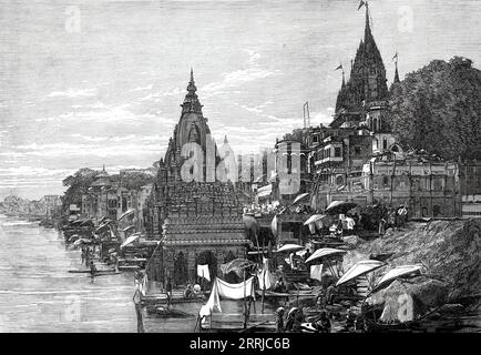 Ghaut at Benares, 1876. 'The sacred city of Benares, considered by the Hindoos as the head-quarters of their religion and science, is situated on the left bank of the Ganges...It is a great mart for the shawl trade, the Dacca muslin trade, and that of Central India...The temples and shrines are very curious...The ghauts, quays, or landing-places are perhaps the most conspicuous feature of Benares at first sight. They present broad and solid stone steps to the river, alternating with numerous temples and pagodas along the entire city front. The Hindoos were formerly allowed to immolate themselv Stock Photo