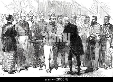 Mr. Layard presenting to the Prince of Wales the address of the Municipal Council at Colombo, Ceylon, 1876. The future King Edward VII recieves a gift from the first mayor of Colombo: a '...casket borne on a cushion...[containing] gold plate on which is inscribed on one side the address in English, on the obverse the same in Cinghalese and Tamil. The work is admirably executed by Mudaliyar Gomes. The Prince, meanwhile, gave a glance at the ivory casket which he held in his hand, and which is well worthy of Royal reception, bedecked as it is, and most tastefully set with circles of pearls and o Stock Photo