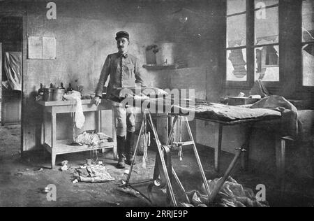 'Bombardment of Vadelaincourt Hospital; The room where, on September 4, a surgeon and wounded man being operated on were killed, and the head doctor wounded; the doctor standing in the background, also present in the room at the time of the explosion, remained the only one unscathed', 1917. From &quot;L'Album de la Guerre 1914-1919, Volume 2&quot; [L'Illustration, Paris, 1924] . Stock Photo