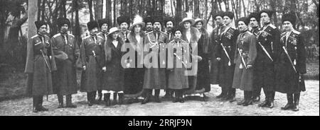 'La Fin d'une Regime et d'un Regne; Une des dernieres photographies de la famille imperiale avant l'abdication; Nicolas II, son fils le tsarevitch Alexis, et les grandes-duchesses, ses filles, au milieu des officiers de sa garde', 1917. The end of a regime and a reign: one of the last photographs of the Russian imperial family before the abdication; Nicholas II, his son tsarevitch Alexis, his daughters, and household guards. The tsar and tsarina and their children were executed by a firing squad on 17 July 1918. From &quot;L'Album de la Guerre 1914-1919, Volume 2&quot; [L'Illustration, Paris, Stock Photo